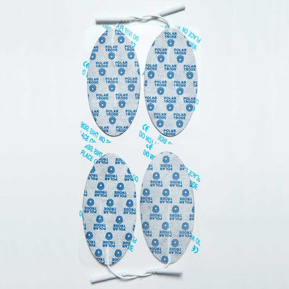 A pack of four white neurostimulation electrodes with blue polarity marks and attached white wires.